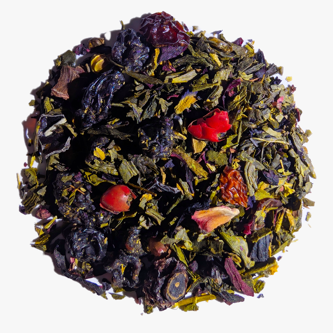 Blueberry Jubilee 40 Serving Loose Leaf by Piper and Leaf Tea Co.: a blend of sencha tea leaves, dried berries, and fruit pieces arranged in a circular pile on a white background.